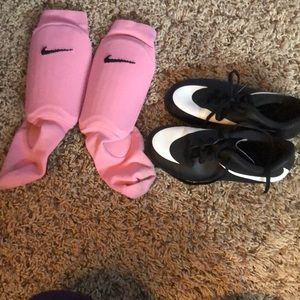 Size 13 girls Nike soccer cleats with shin guards